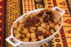 A bowl of food with star anise